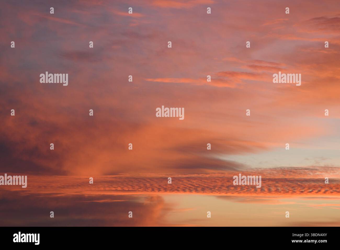 Romantic. Incredibly beautiful sunset. Pink clouds. Universal horizontal picture. The background picture. Stock Photo