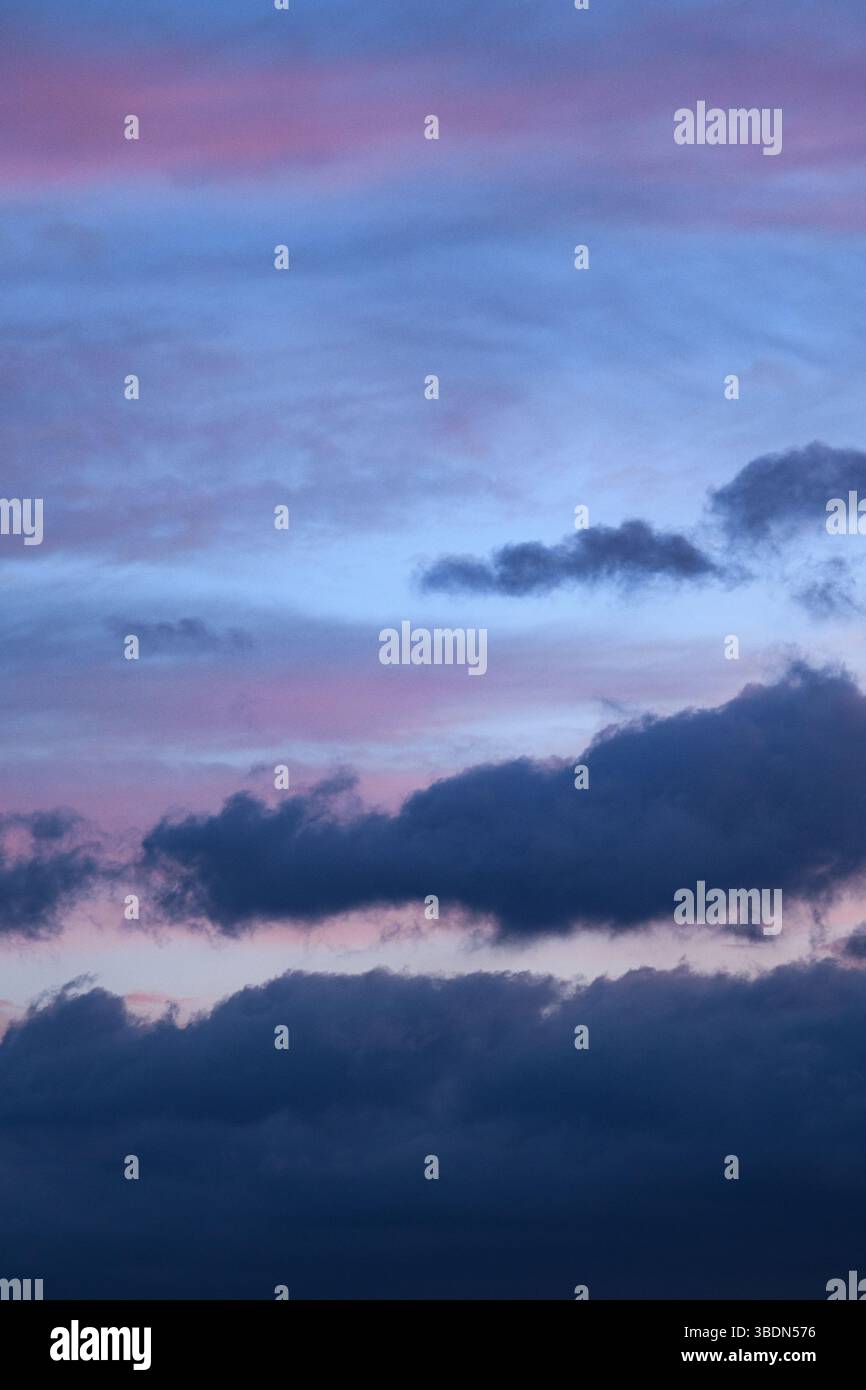 Romantic sky. Vertical photograph of blue clouds in overcast weather at ...
