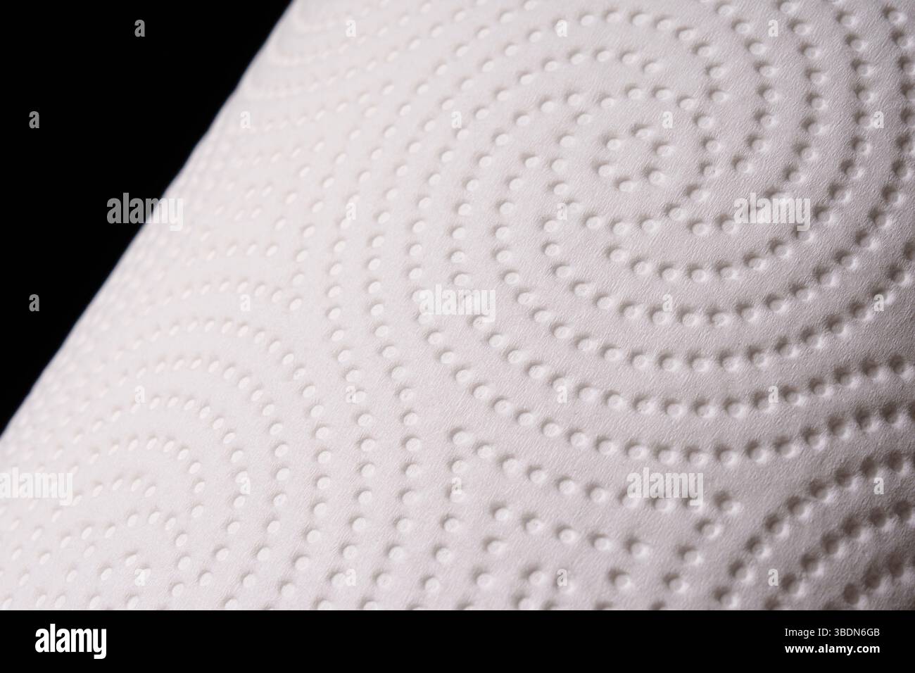 Texture of white paper towel on black background. Macro. Soft, delicate paper. Stock Photo
