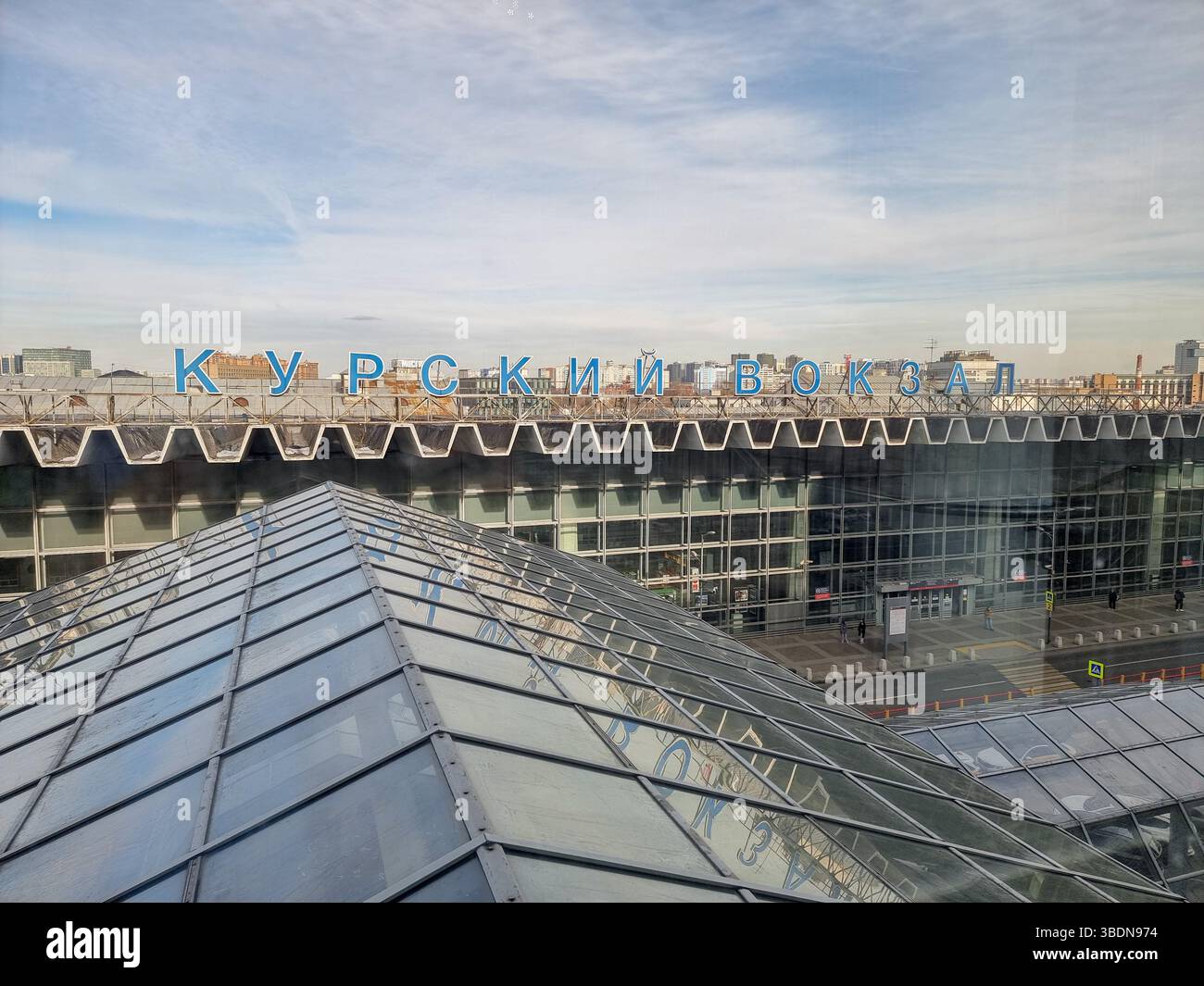 View on roof of Kurskij Vokzal / Kurskyy Vokzal (Kursk railway station) with station name Курский Вокзал in Cyrillic letters,  in Moscow, Russia - Smartphone Captured Stock Image