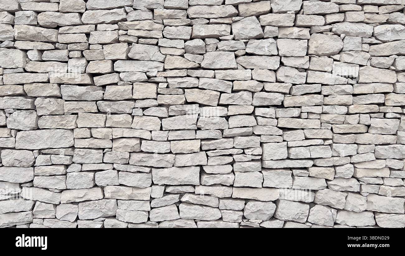 A wall made of natural white stone. - Smartphone Captured Stock Image