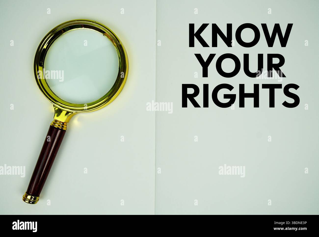Know Your Rights text with magnifying glass flat lay on notepad background Stock Photo