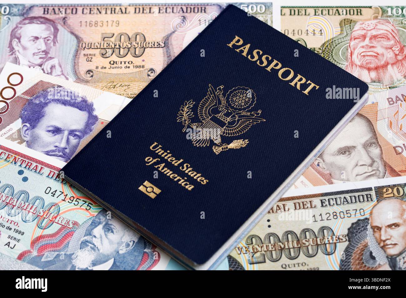 American passport on Ecuadorian  money - Sucre Stock Photo
