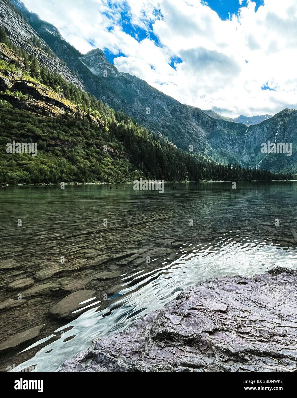 Clear mountain lake with calm and blue water hi-res stock photography ...