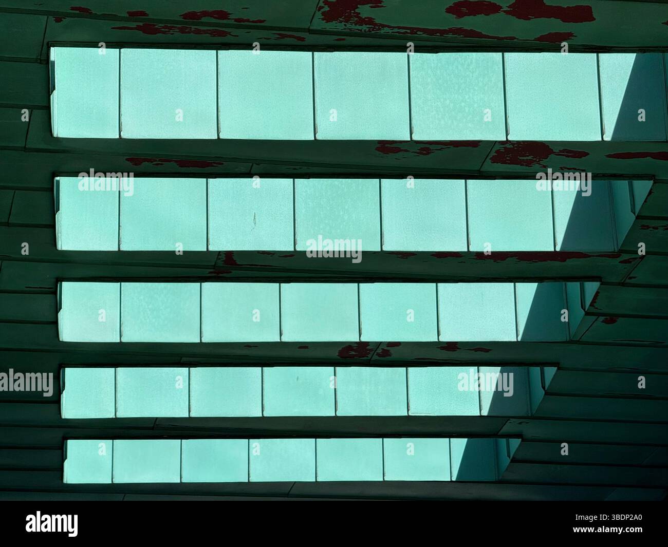 Abstract of canopy roof of Bolton One (part of University of Greater Manchester) against a blue sky - Smartphone Captured Stock Image