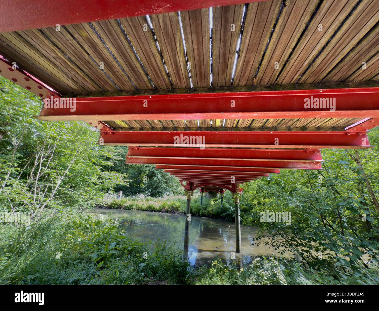 Underneath the Dobson wrought iron bridge in Crompton bridge in Queen’s Park in Bolton town centre - Smartphone Captured Stock Image