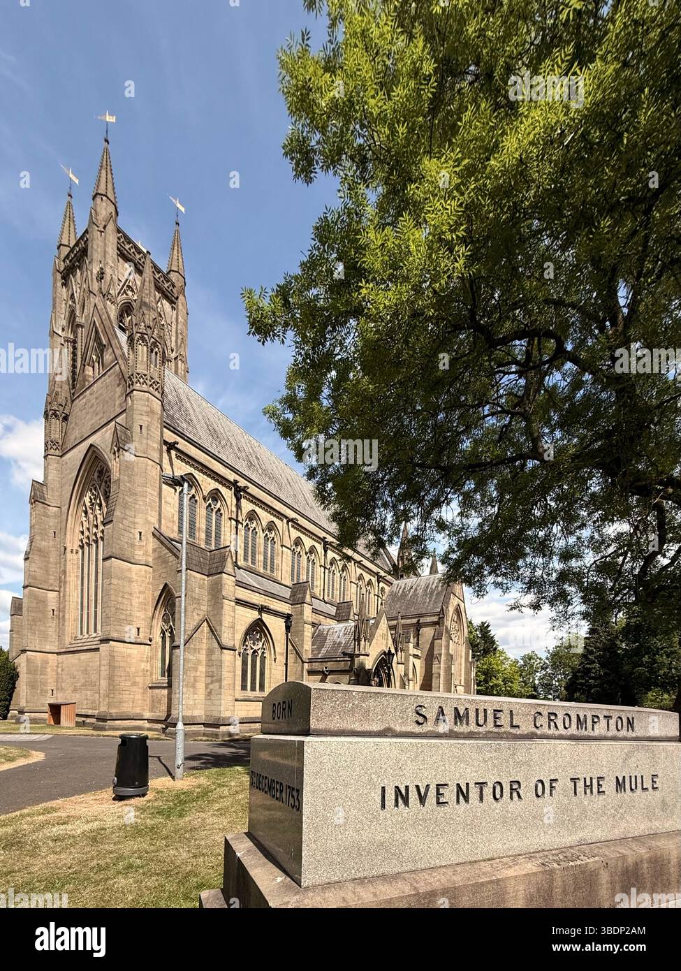 Tomb of Samuel Crompton (inventor of the Mule) in graveyard of Bolton parish church. St Peter’s church in background - Smartphone Captured Stock Image