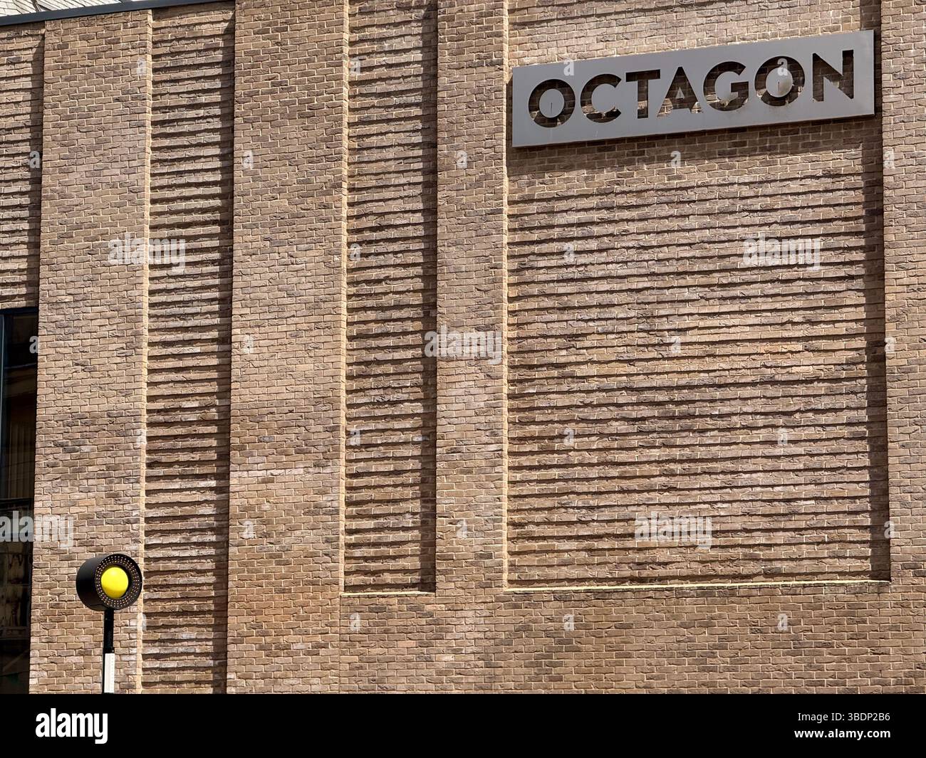Detail of brickwork of Octagon theatre and Belisha beacon in Bolton town centre - Smartphone Captured Stock Image