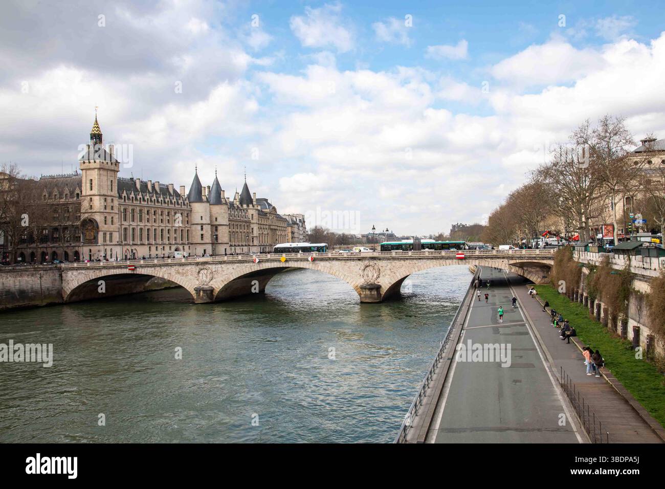 The Conciergerie, Pont au Change crossing River Seine and Voie Georges Pompidou in Paris, France Stock Photo