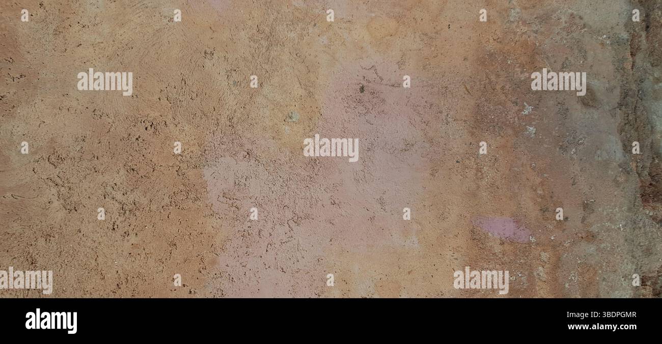 Weathered wall displaying natural earthy hues and textures Stock Photo