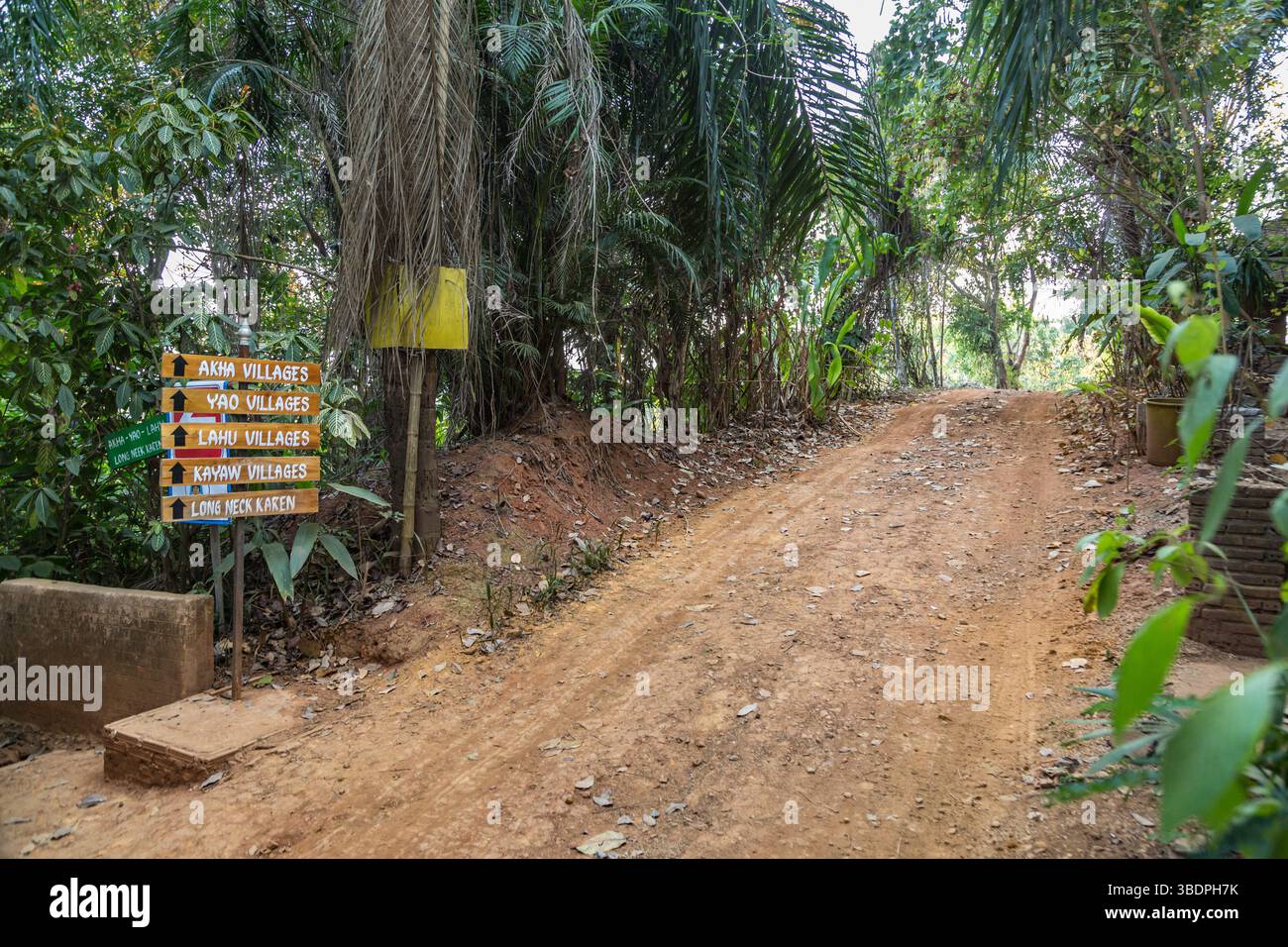 Dirt road into the Union of Hill Tribe Villages representing the Akha, Yao, Lahu, Kayaw, and Long neck Karen or Kayan people groups outside of Chiang Stock Photo