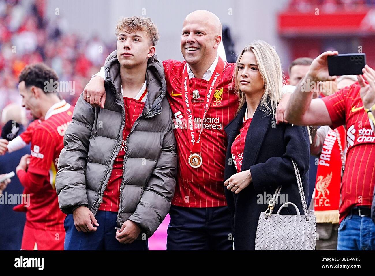 Liverpool manager Arne Slot (centre) with children Joep (left) and Isa ...