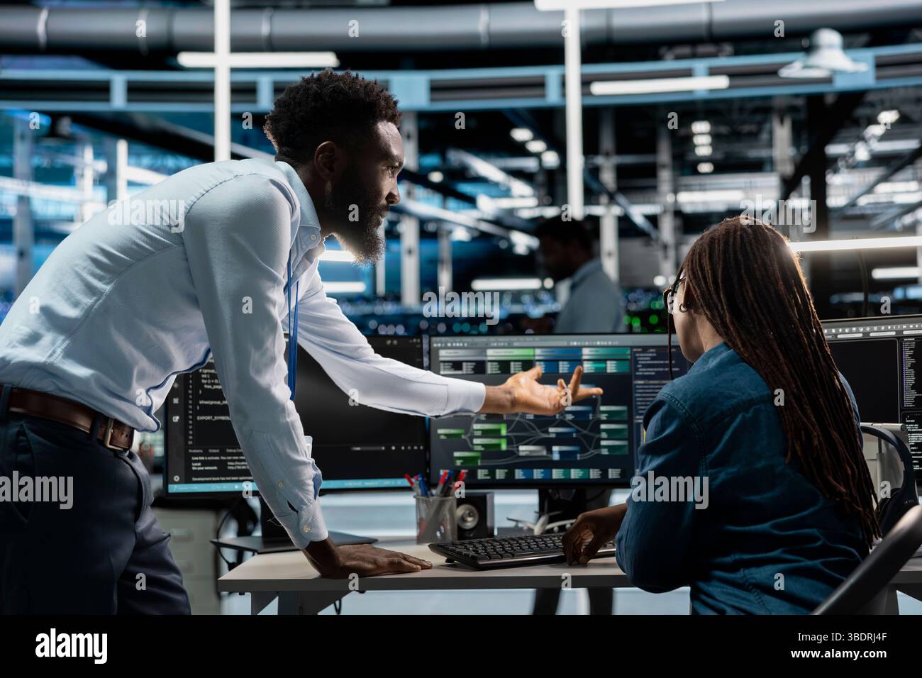 Data center system administrators setting up machine learning systems handling information. IT professionals in office training neural networks node trees to improve server farm operations Stock Photo