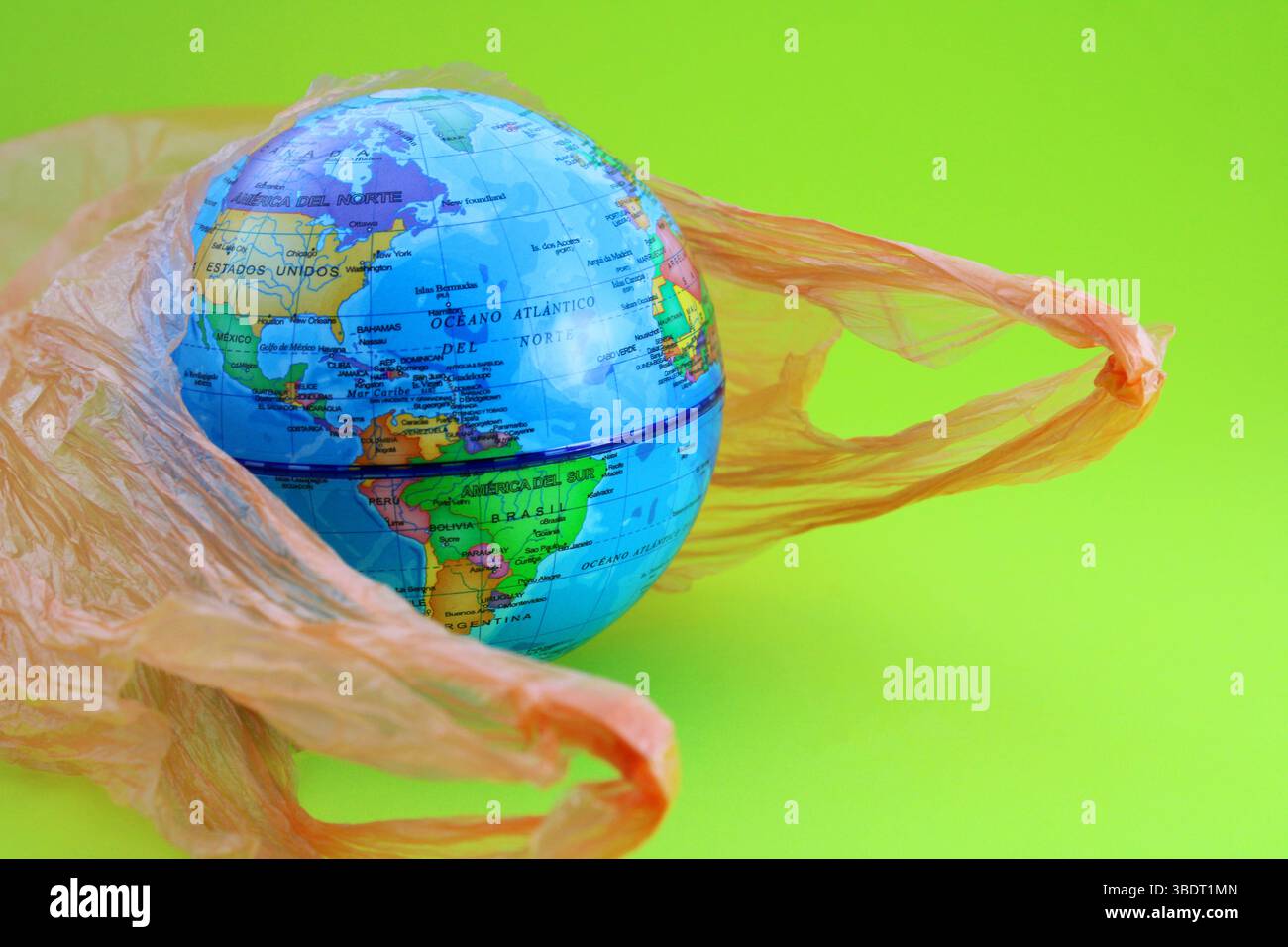 Planet emerging from a garbage bag, showing the American continent Stock Photo