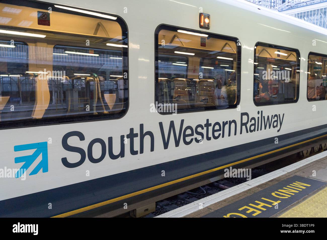 London Waterloo Terminal, UK – 25th May 2025: Passengers Board and ...