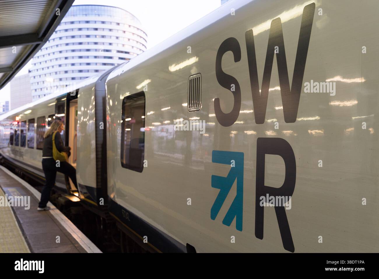 London Waterloo Terminal, UK – 25th May 2025: Passengers Board and ...