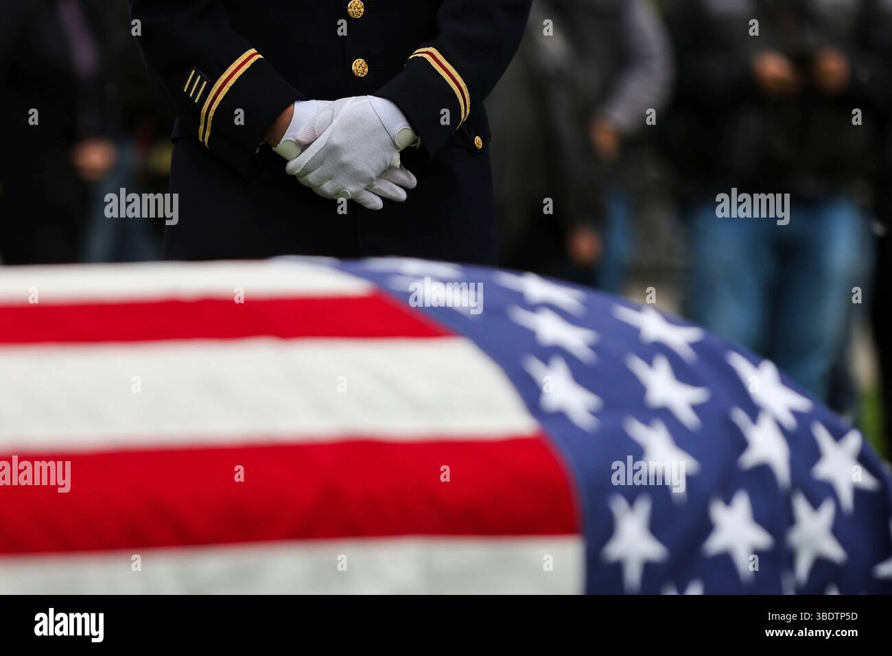 Jason Fetterolf of the U.S. Army Reserve stands during the interment ...