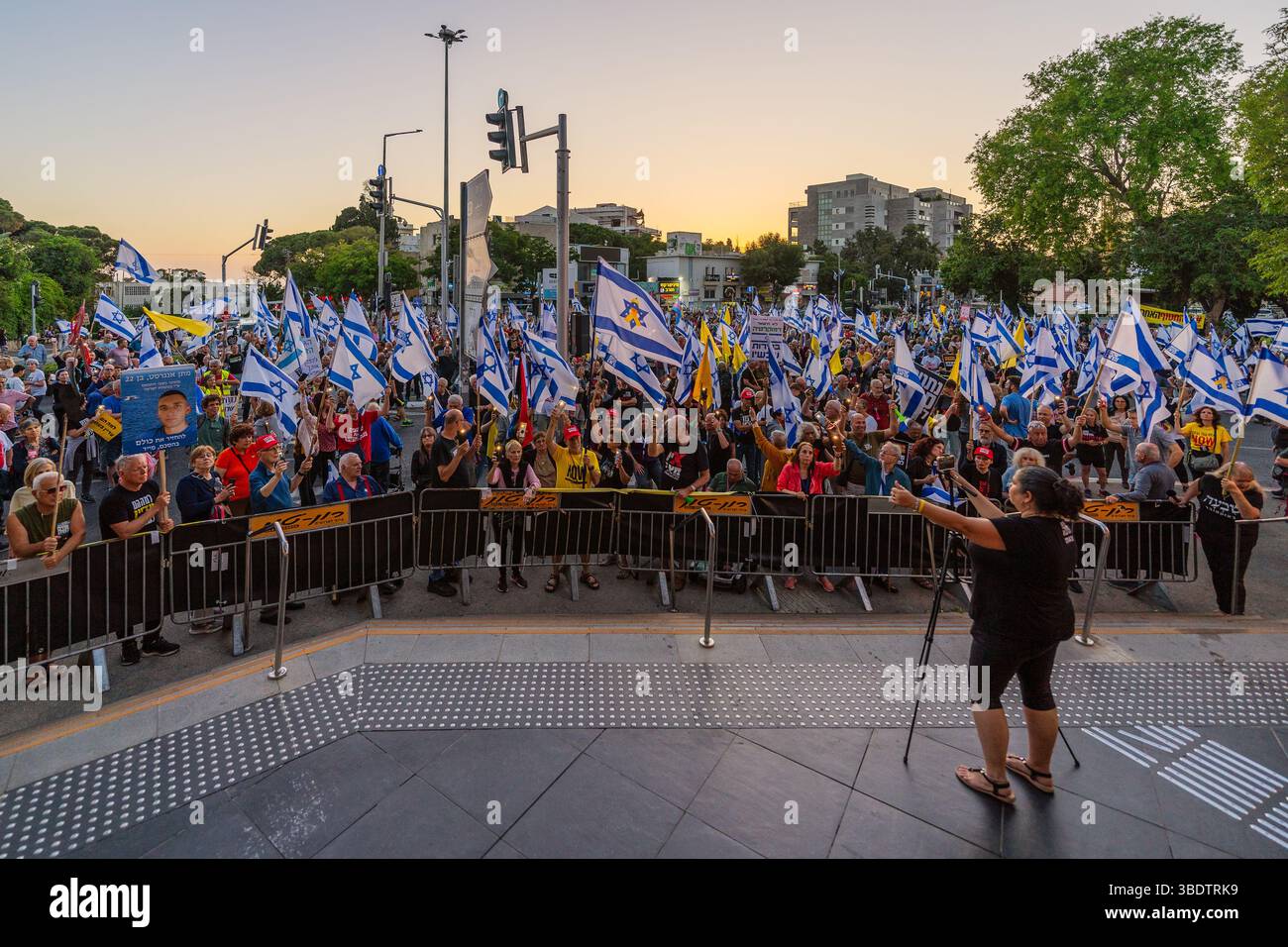 Haifa, Israel - May 24, 2025: Crowd of people with various signs and ...
