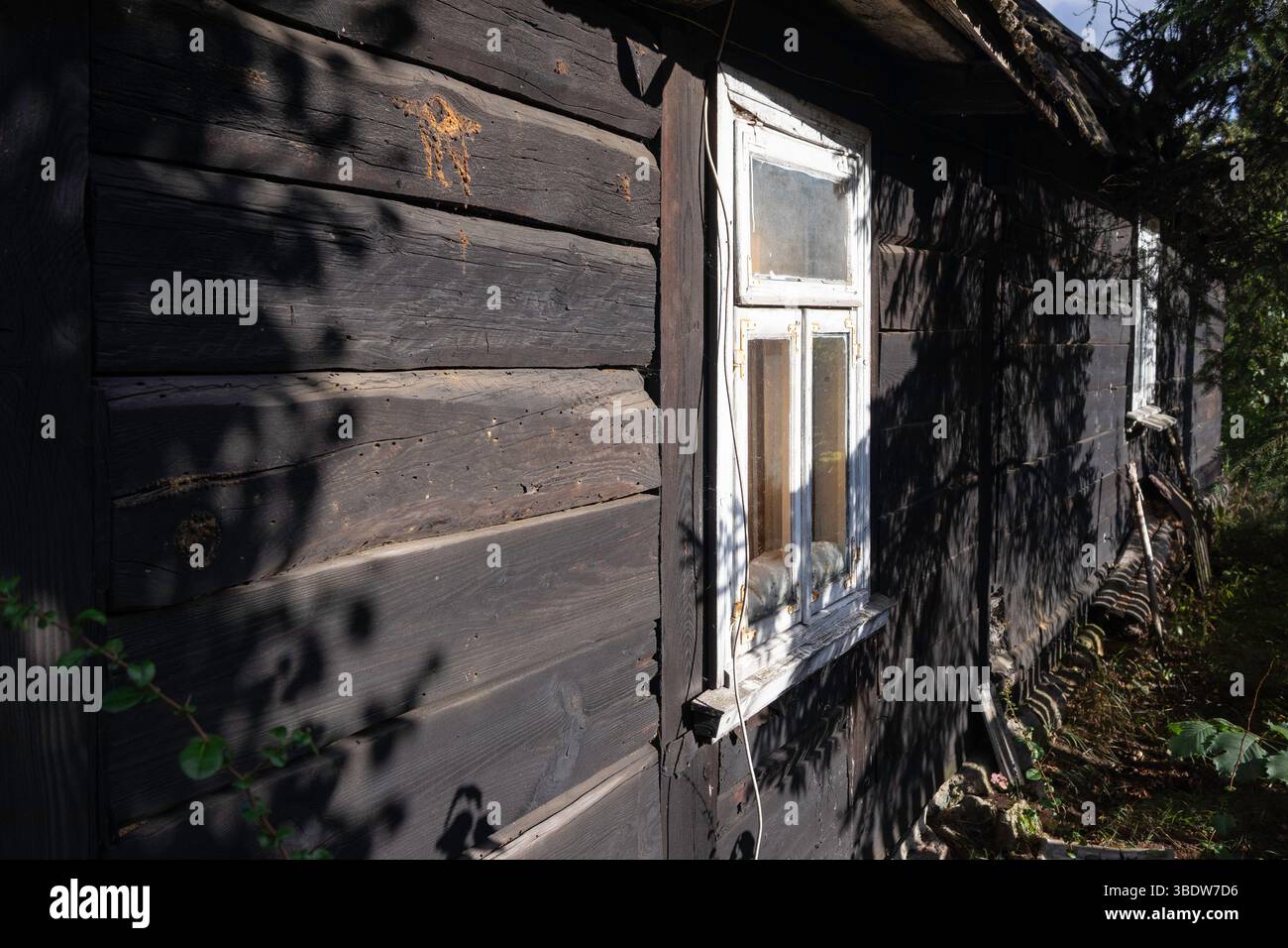 A house with a window and a door. The window is white and the door is ...