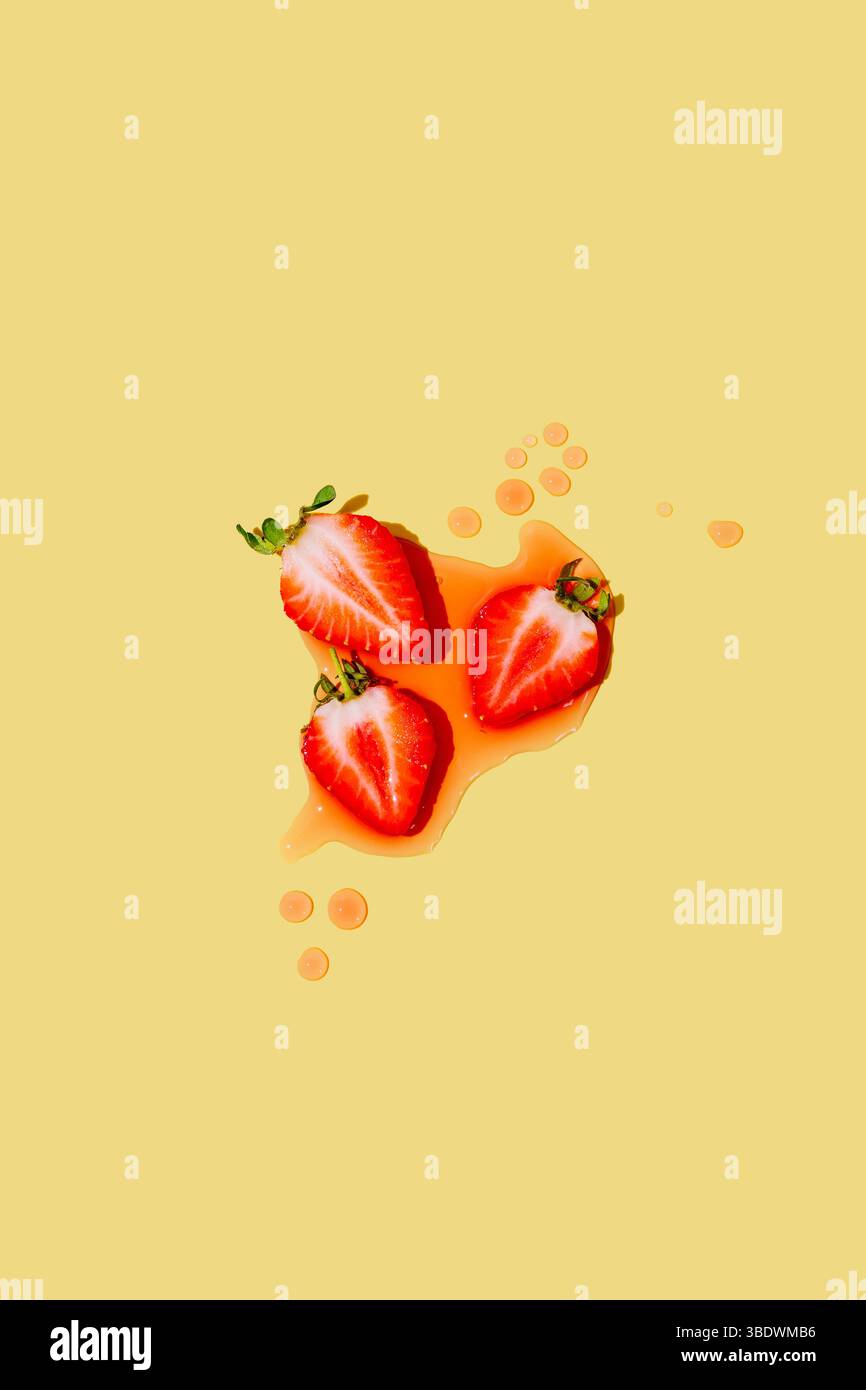 Abstract summer fruit background. Fresh strawberries on yellow Stock Photo