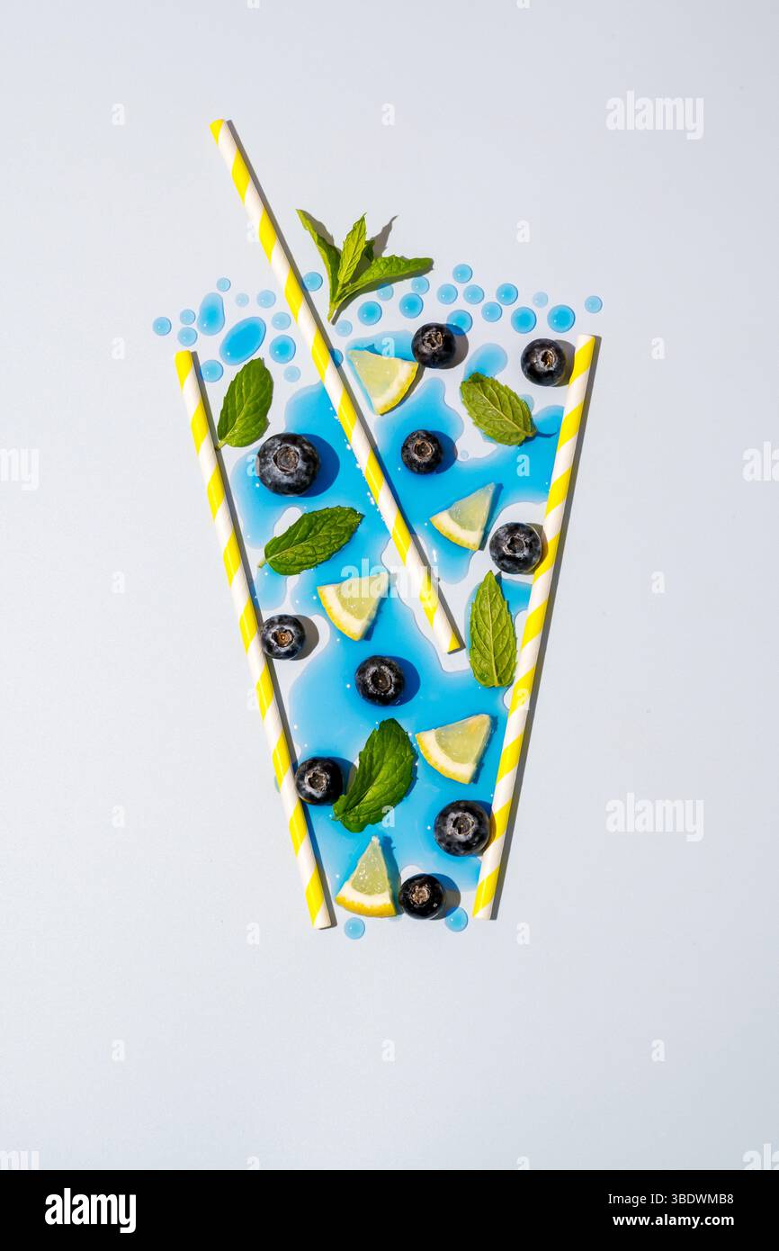 Abstract blueberry, lemon slices drink concept with ice cubes and mint Stock Photo
