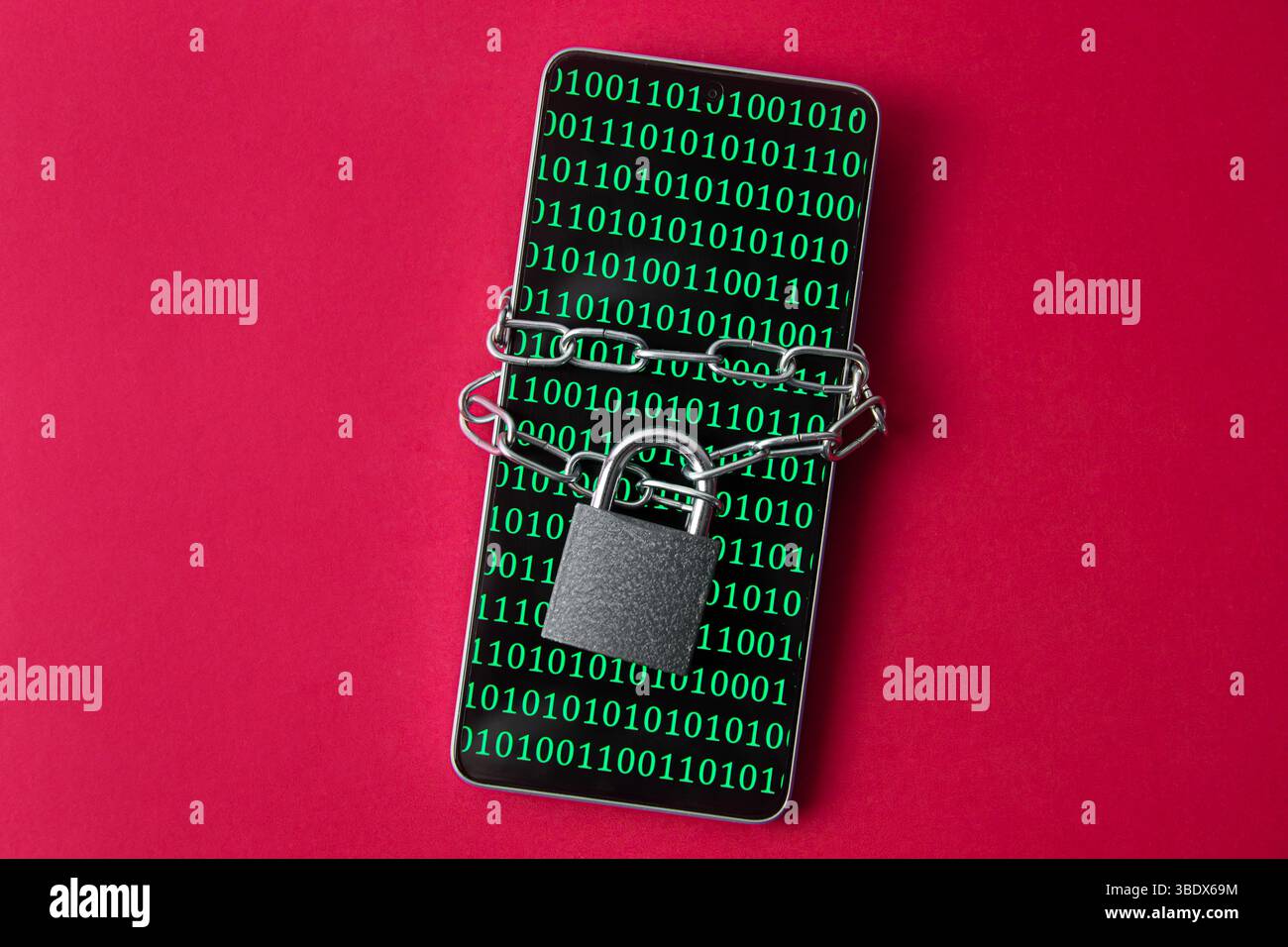 A smartphone with a screen displaying binary code, secured with a chain and a lock. A concept of internet and virtual security. Stock Photo