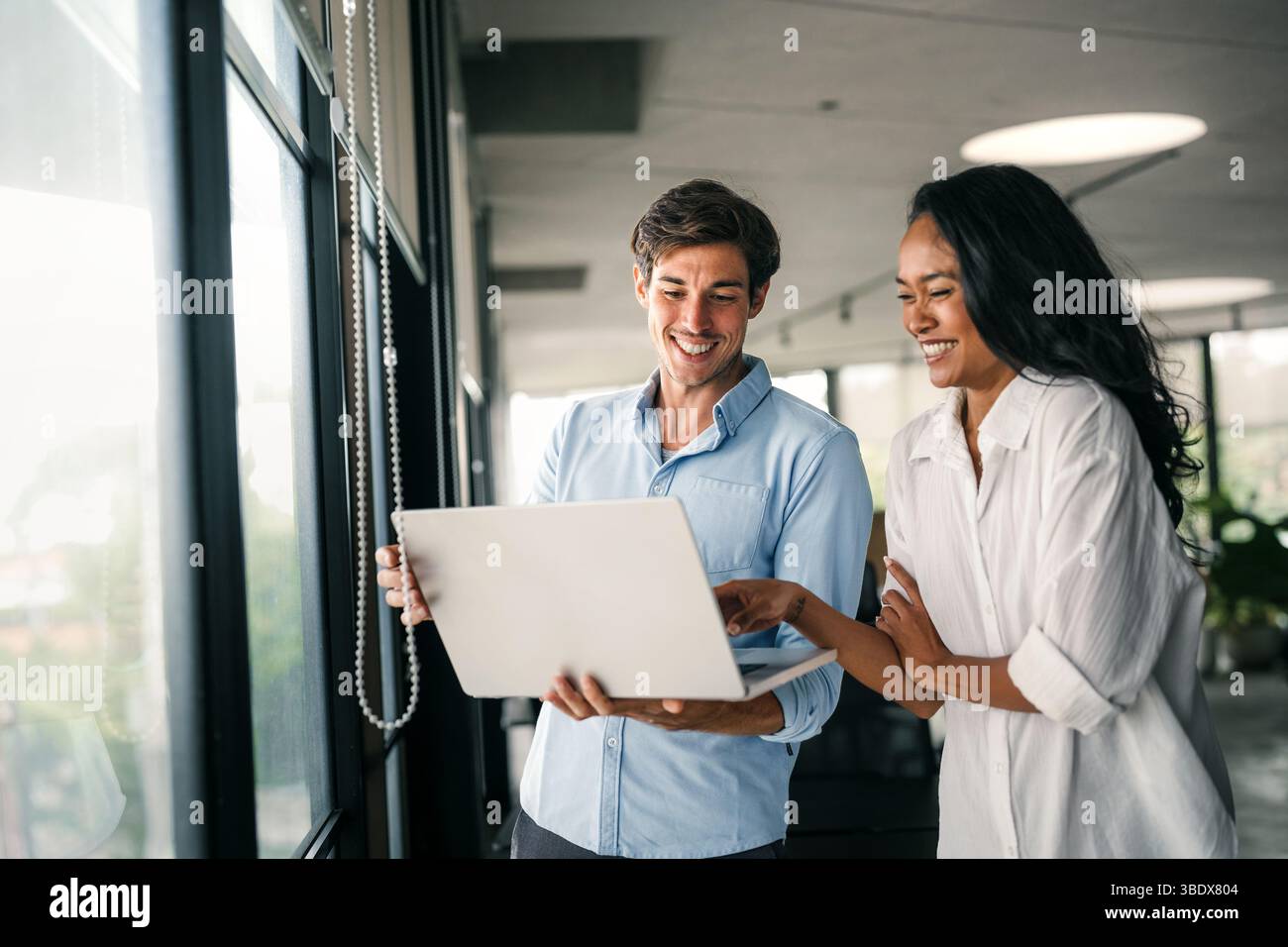 Multicultural professional businesspeople working together on research plan in boardroom. Stock Photo
