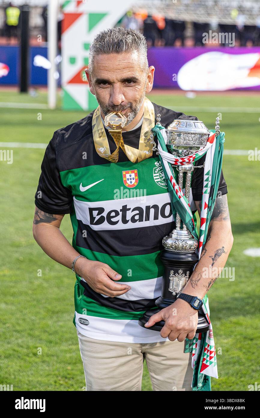 Head Coach Rui Borges Of Sporting CP Celebrates With The Trophy During Head Coach Rui Borges Of Sporting CP Celebrates With The Trophy During