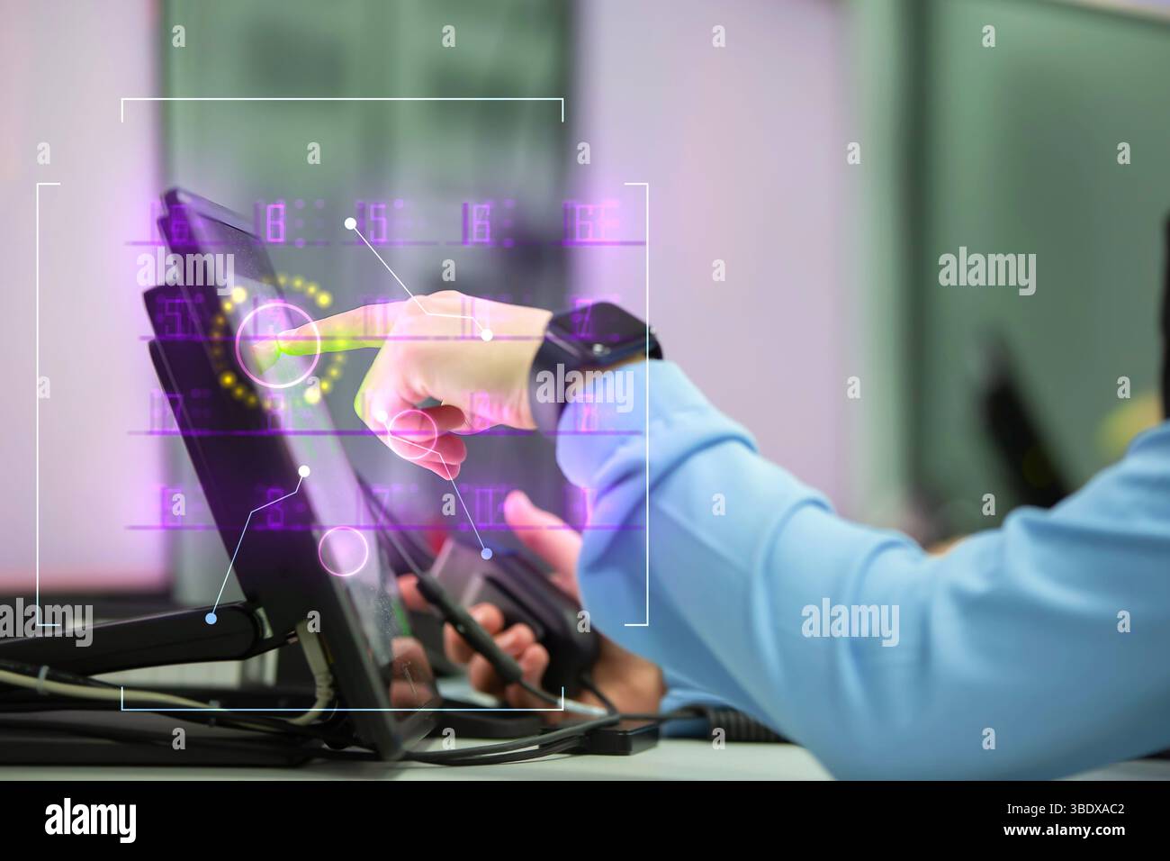 A human finger points to a computer screen with a green button. It displays graphs and glows from numbers. New technologies. Stock Photo