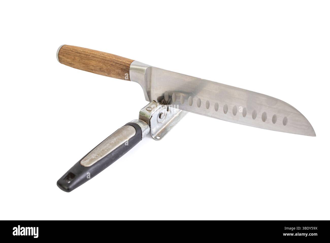 Vintage knife sharpener with a santoku chef knife, isolated on white Stock Photo