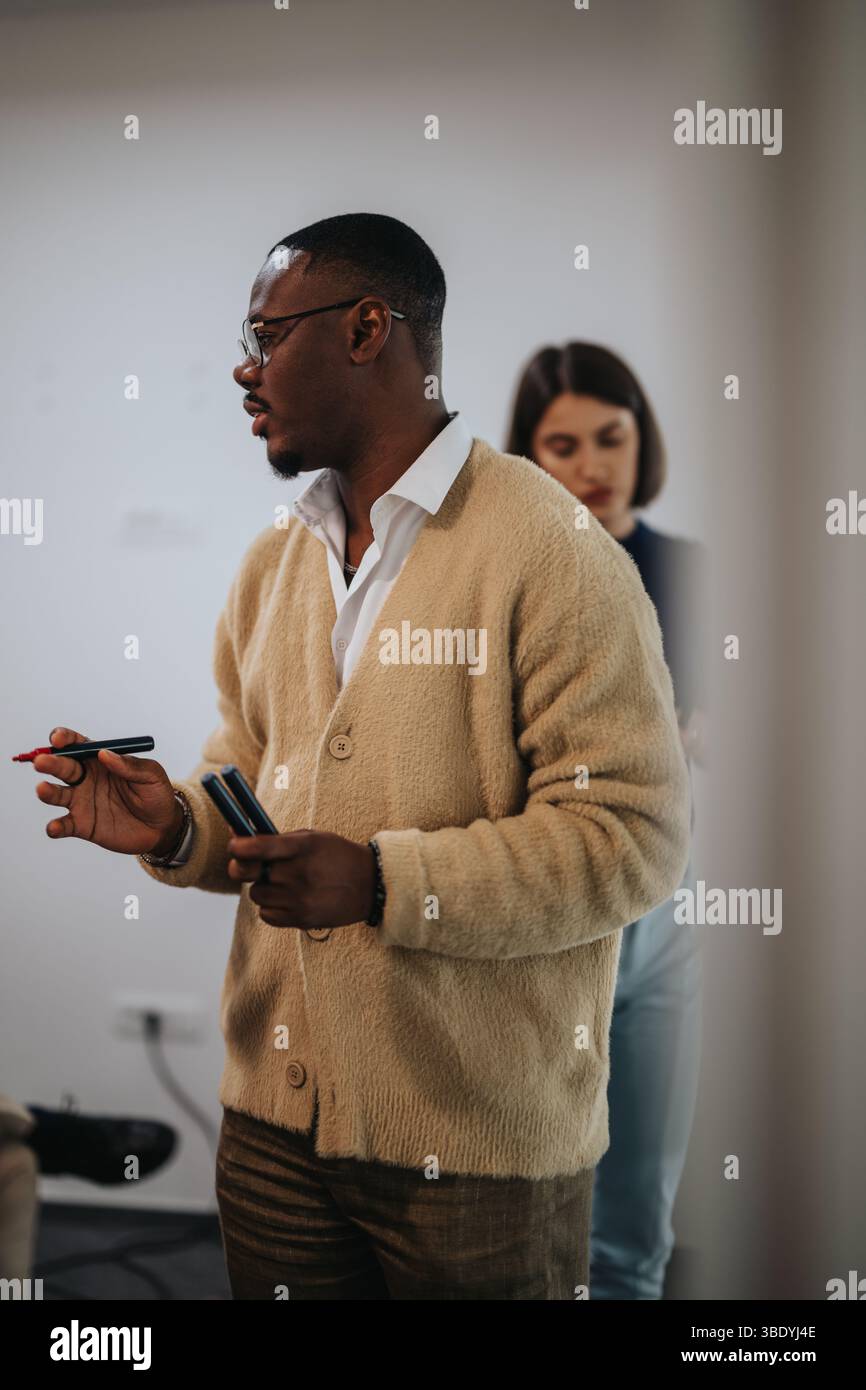 Multicultural business employees collaborating during office meeting Stock Photo