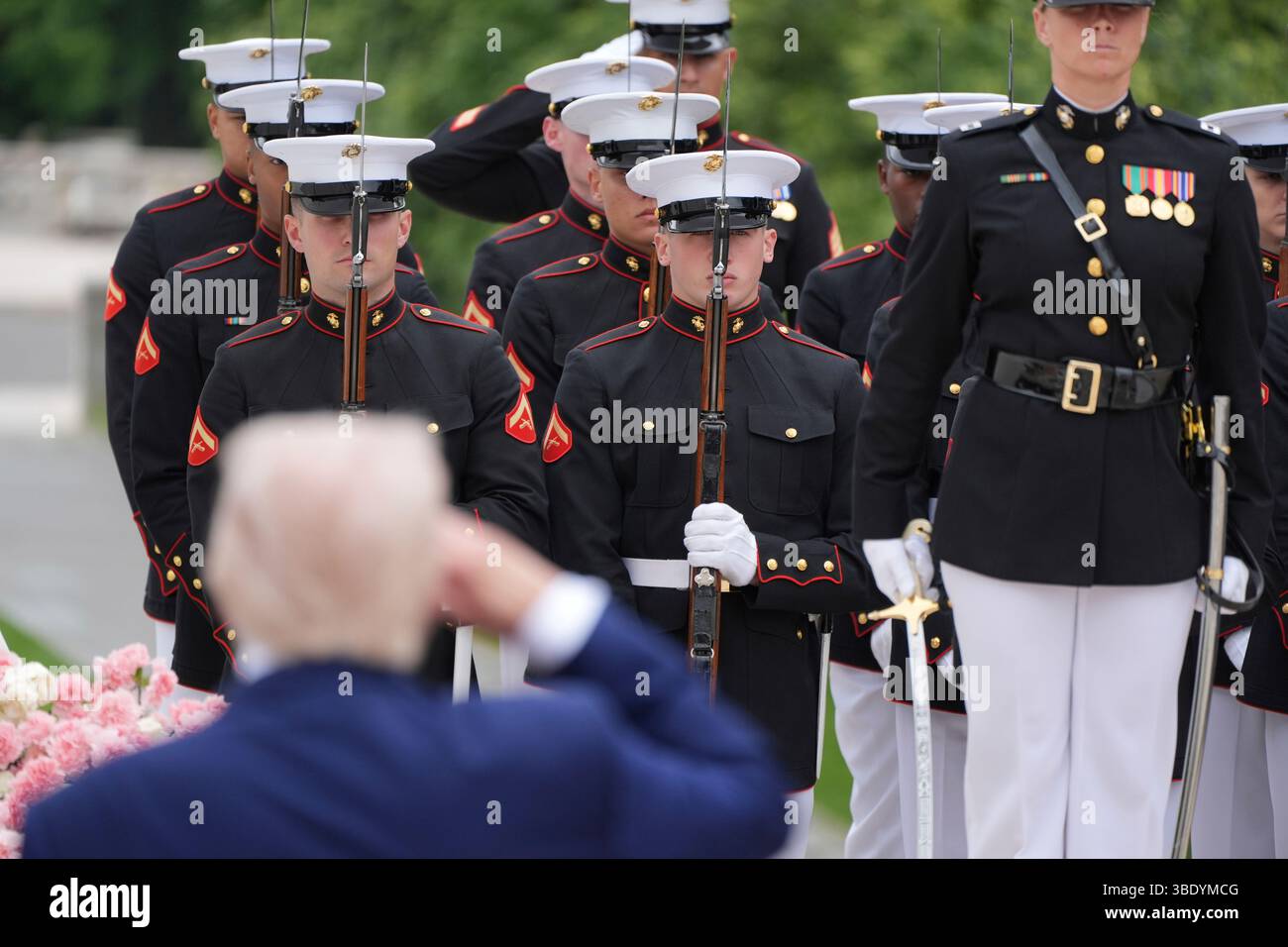 President Donald Trump salutes during a Memorial Day wreath laying ...