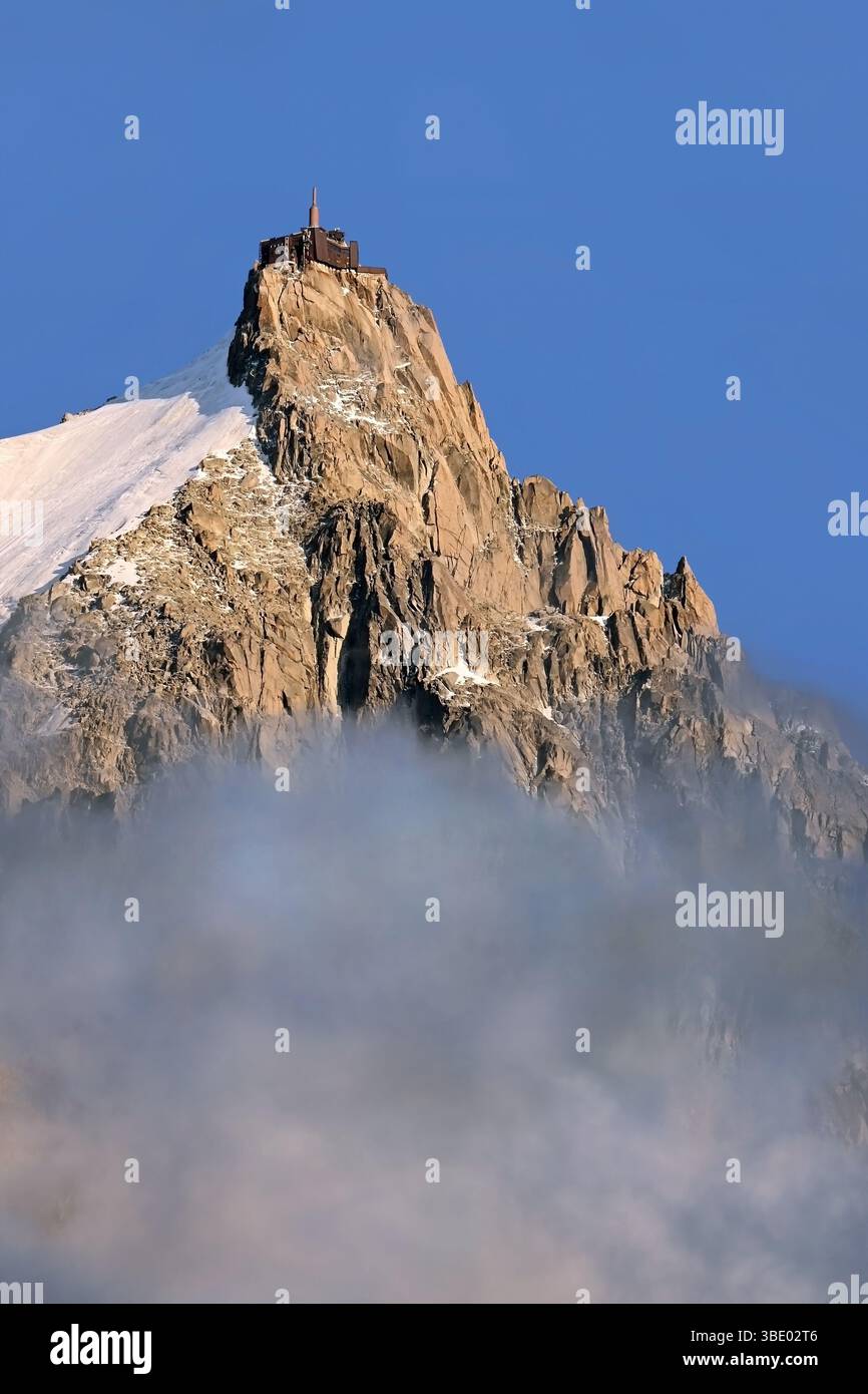 summit-of-aiguille-du-midi-with-alpine-buildings-emerging-from-the-mist
