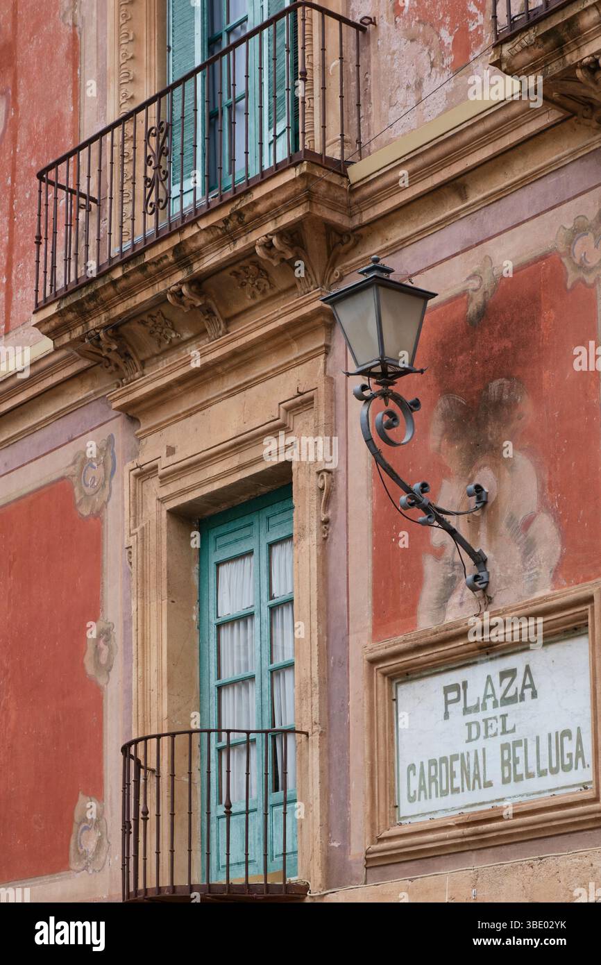 Historical building with decorative facade and street sign reading Plaza del Cardenal Belluga in Murcia,  Spain Stock Photo