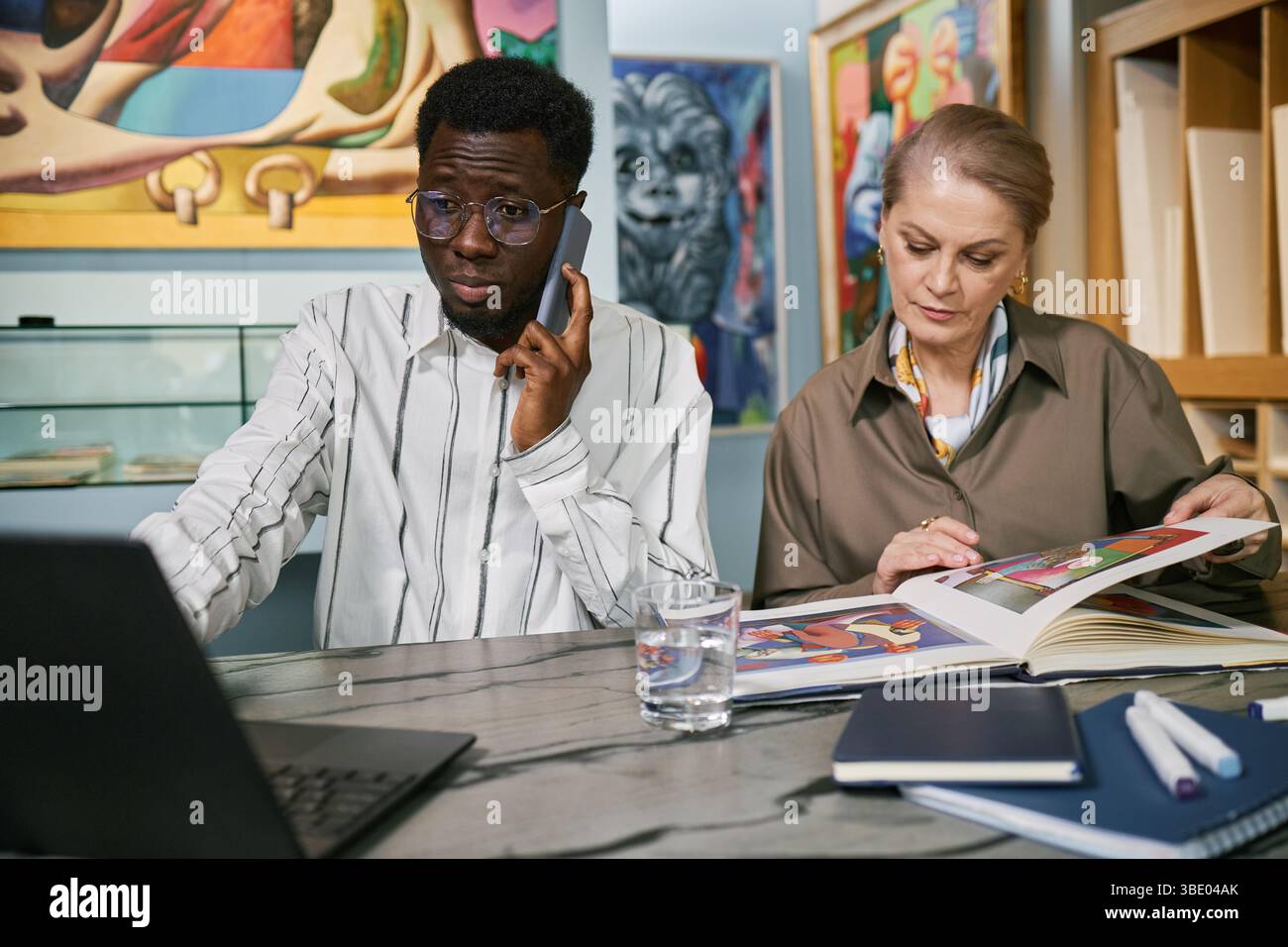 Collaborating on Art Project in Modern Studio Stock Photo