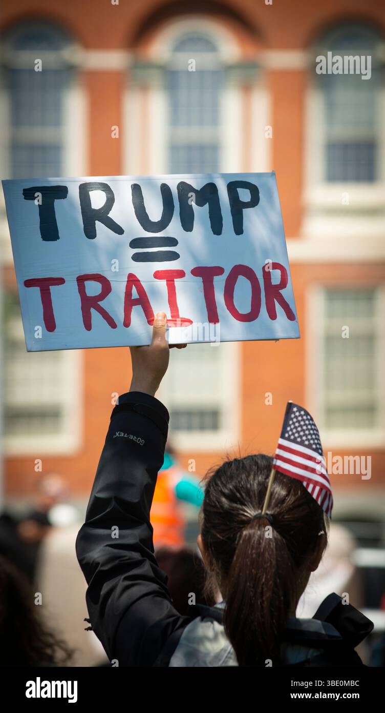 Anti-Trump Rally, Boston, Massachusetts, USA, 26 May 2025. Several hundred people, organized by 50501, gathered at the Boston City Hall and marched through central Boston to the Boston Common. 50501 a grassroots movement founded to resist the anti-democracy policies of the current U.S. federal Government. 505001, 50 states, 50 protests, one day, has organized nationwide pro-democracy demonstrations since Donald Trump became the U.S. President.  Woman holding sign during rally in front of the Massachusetts State House. Credit: Chuck Nacke / Alamy Live News Stock Photo
