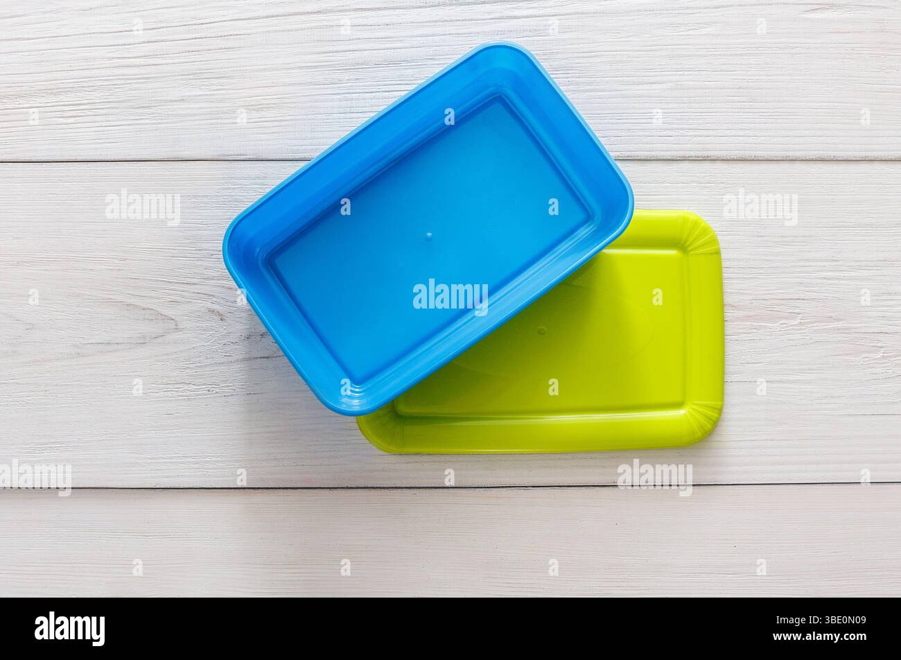 Empty plastic lunch boxes on white wood, top view Stock Photo