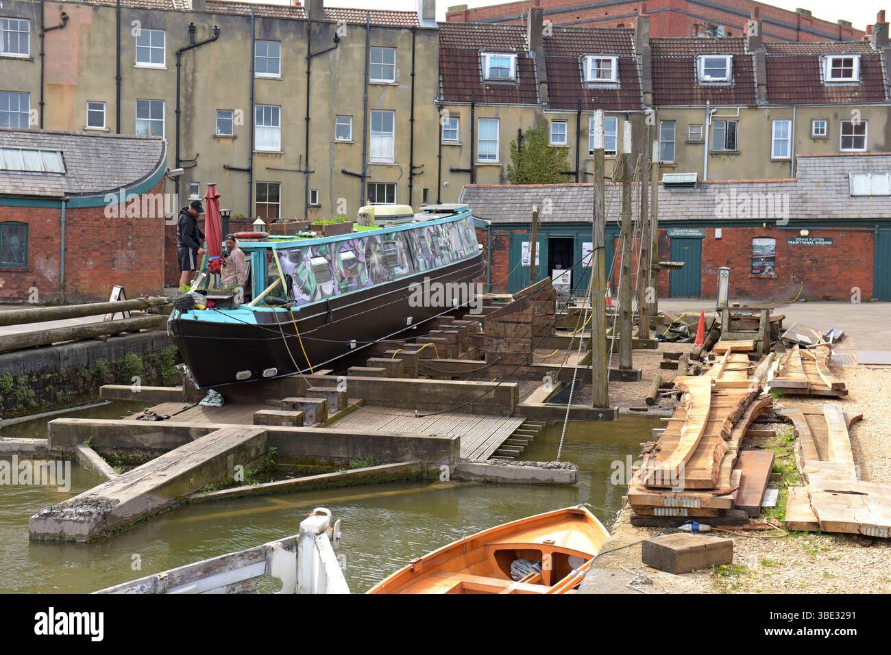 Canal narrow boat on the historic Heave Up slipway at Underfall Yard dockyard, Bristol Harbour, April 2025 Stock Photo