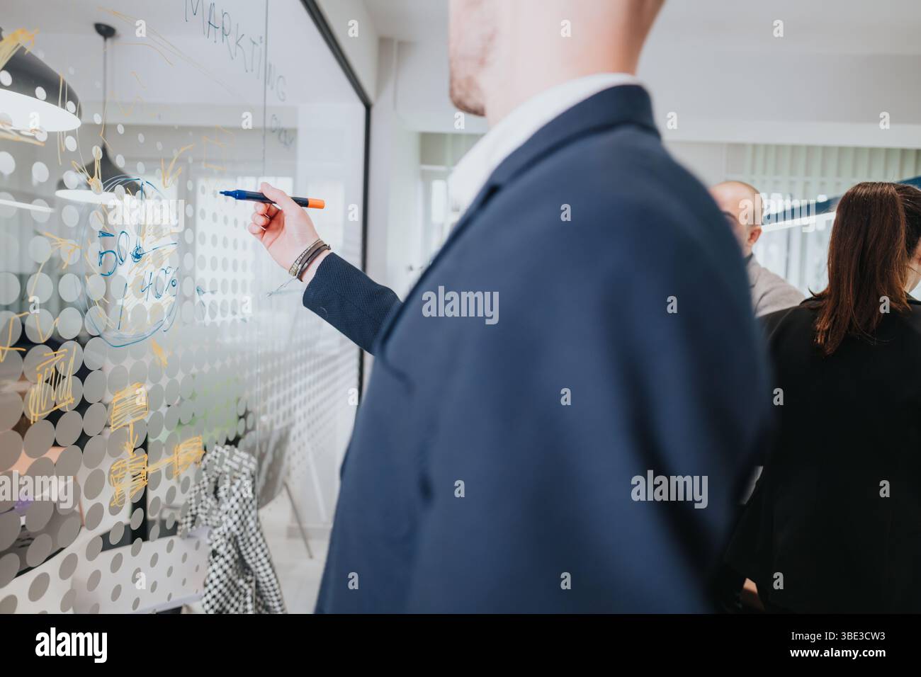 Business colleagues collaborating on a strategy during a meeting Stock Photo