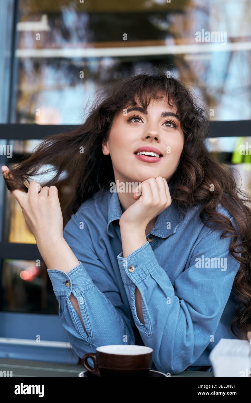 Woman thinking on lively city hi-res stock photography and images - Alamy