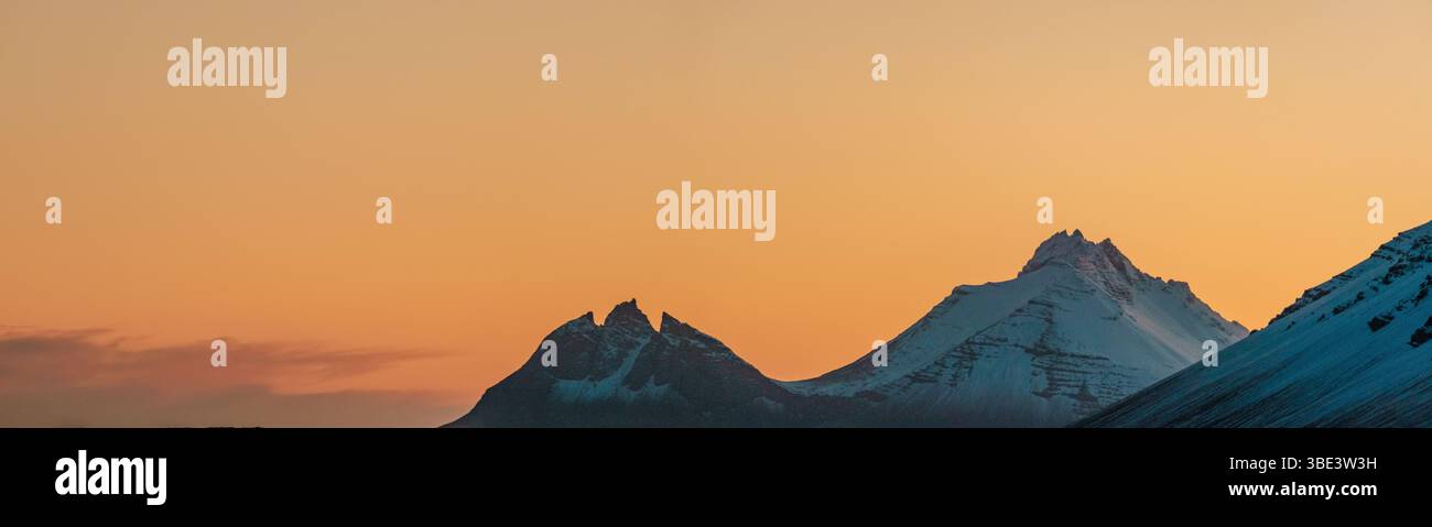 Brunnhorn mountain silhouetted at sunrise in East Iceland. Stock Photo