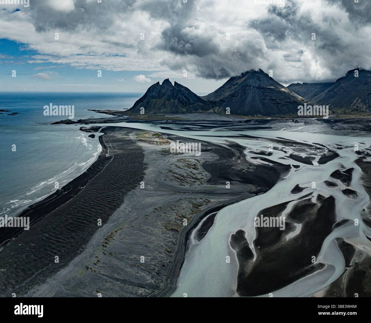 Dramatic aerial view of Brunnhorn mountain and braided river delta, Iceland. Stock Photo
