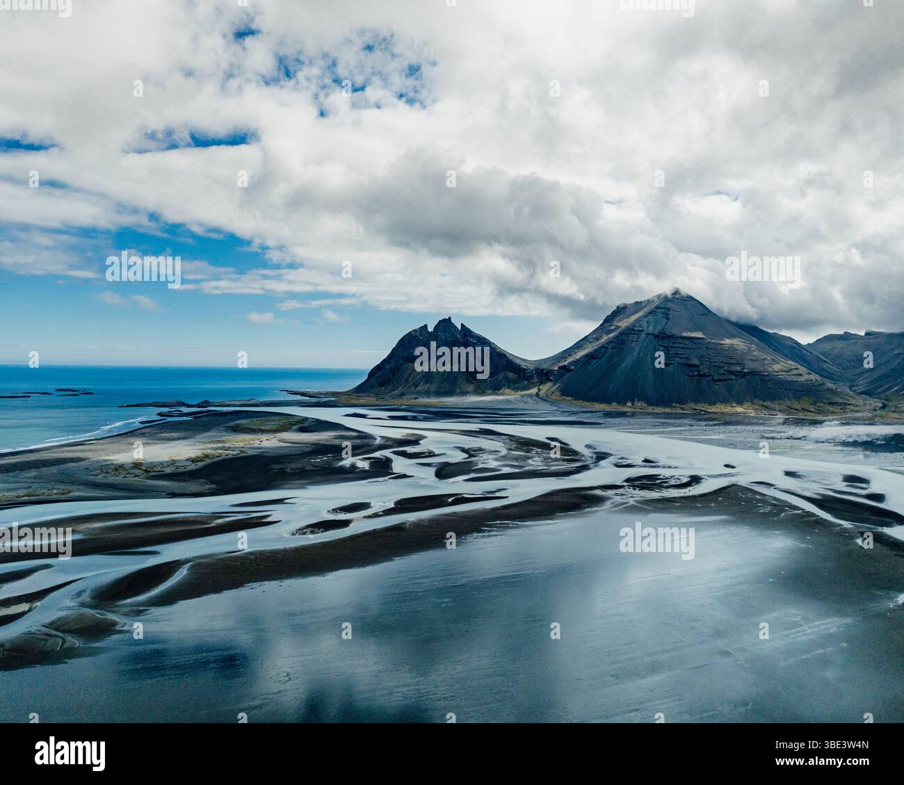 Aerial view of Brunnhorn mountain and braided glacial rivers, East Iceland. Stock Photo