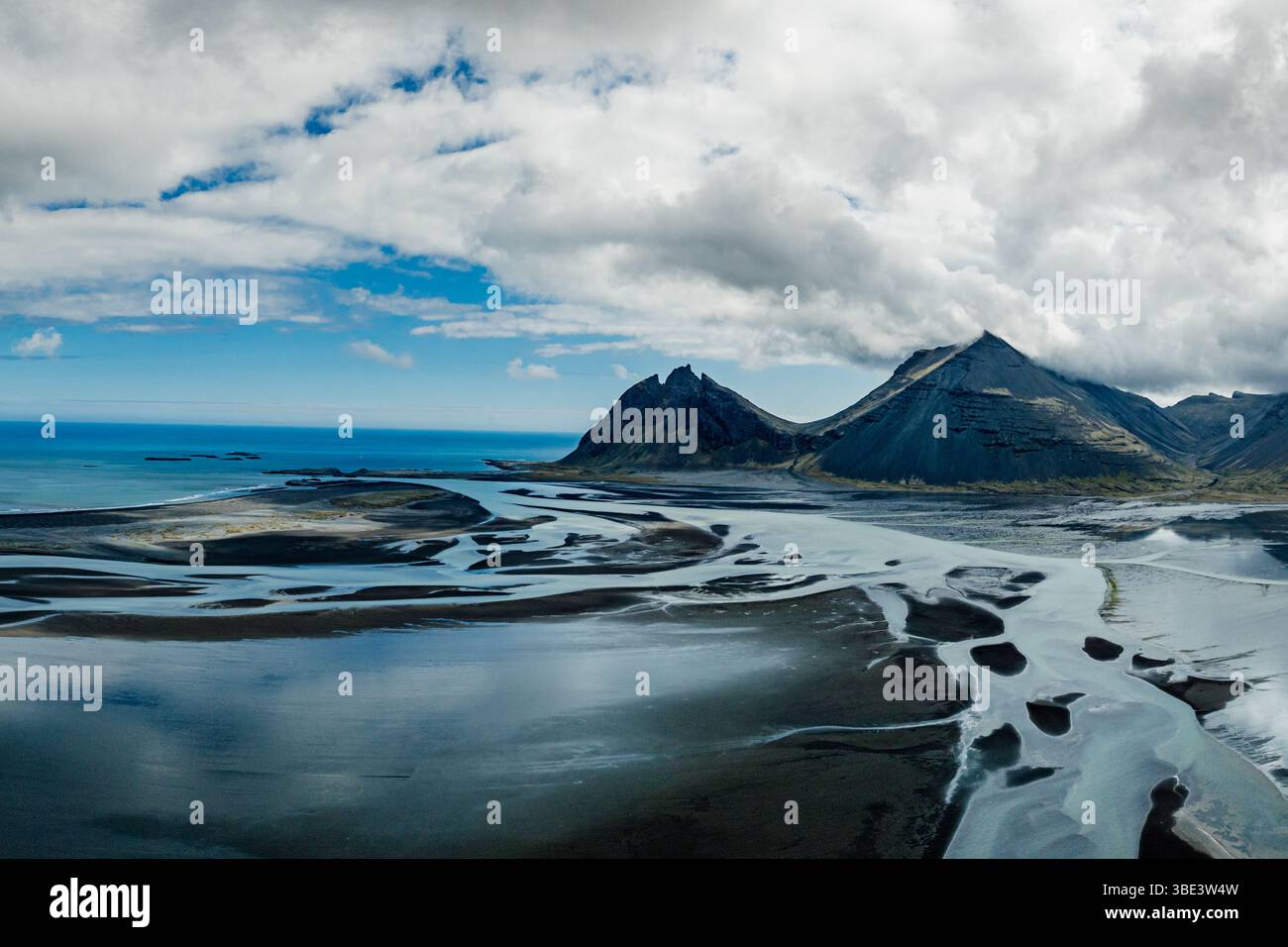 Aerial view of Brunnhorn mountain and braided glacial rivers, East Iceland. Stock Photo