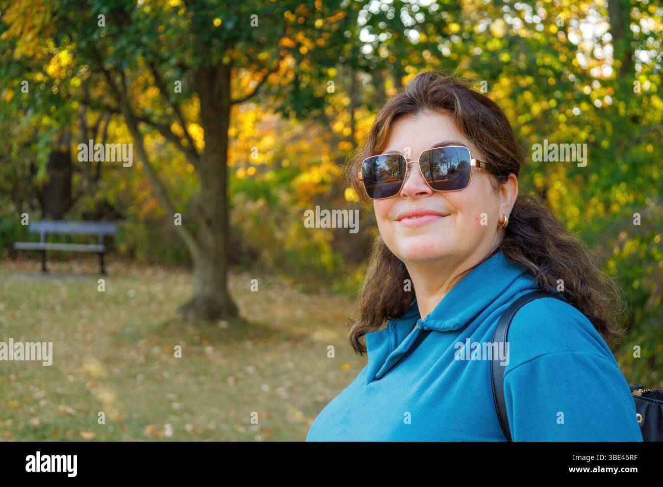 Portrait of a middle-aged woman in a public park. Stock Photo