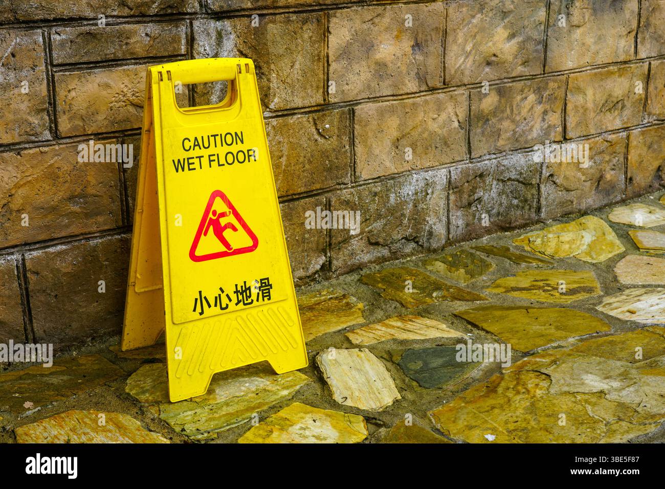 Plastic wet floor warning sign with bilingual text English and Chinese ...