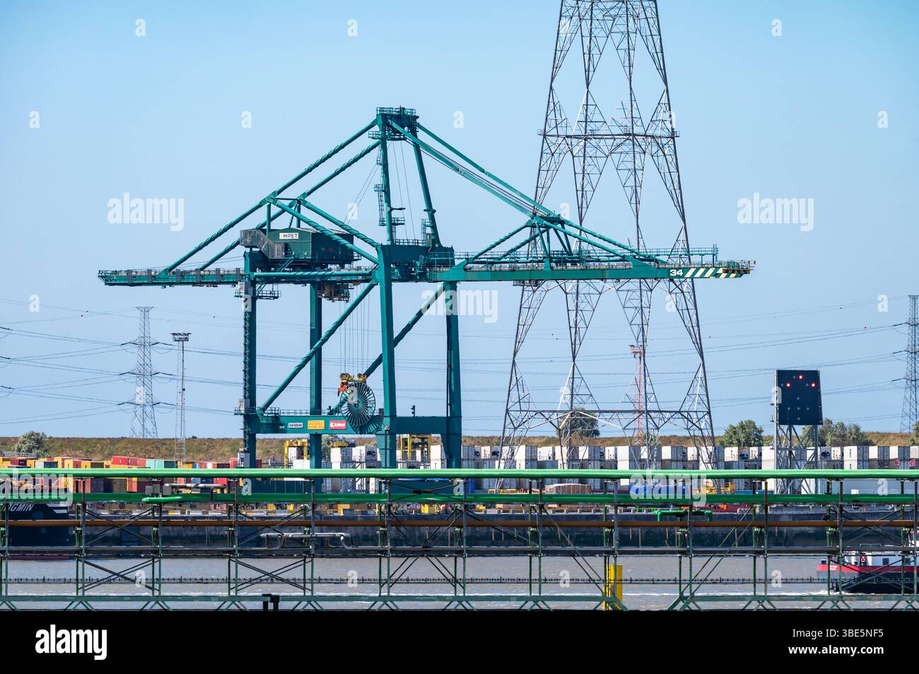 Large loading crane at the banks of the river Scheldt part of the Port ...