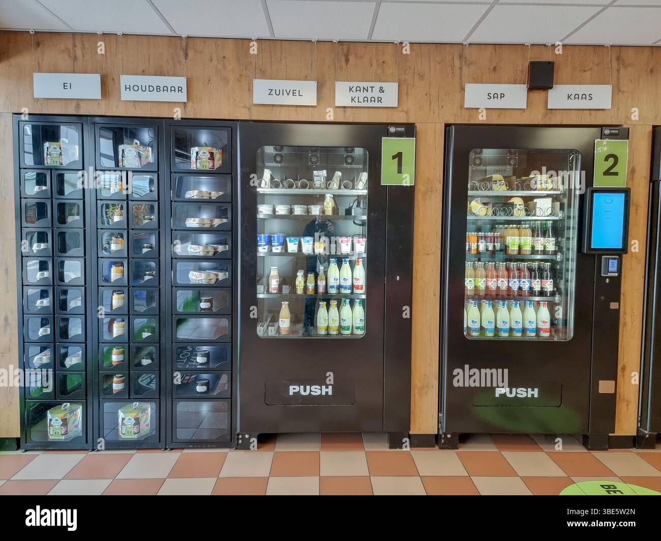 Unmanned shop with only vending machines 'De Aurtomatenshop', selling fresh local food, dairy, meat, eggs, jams, etc. in Eindhoven, The Netherlands - Smartphone Captured Stock Image