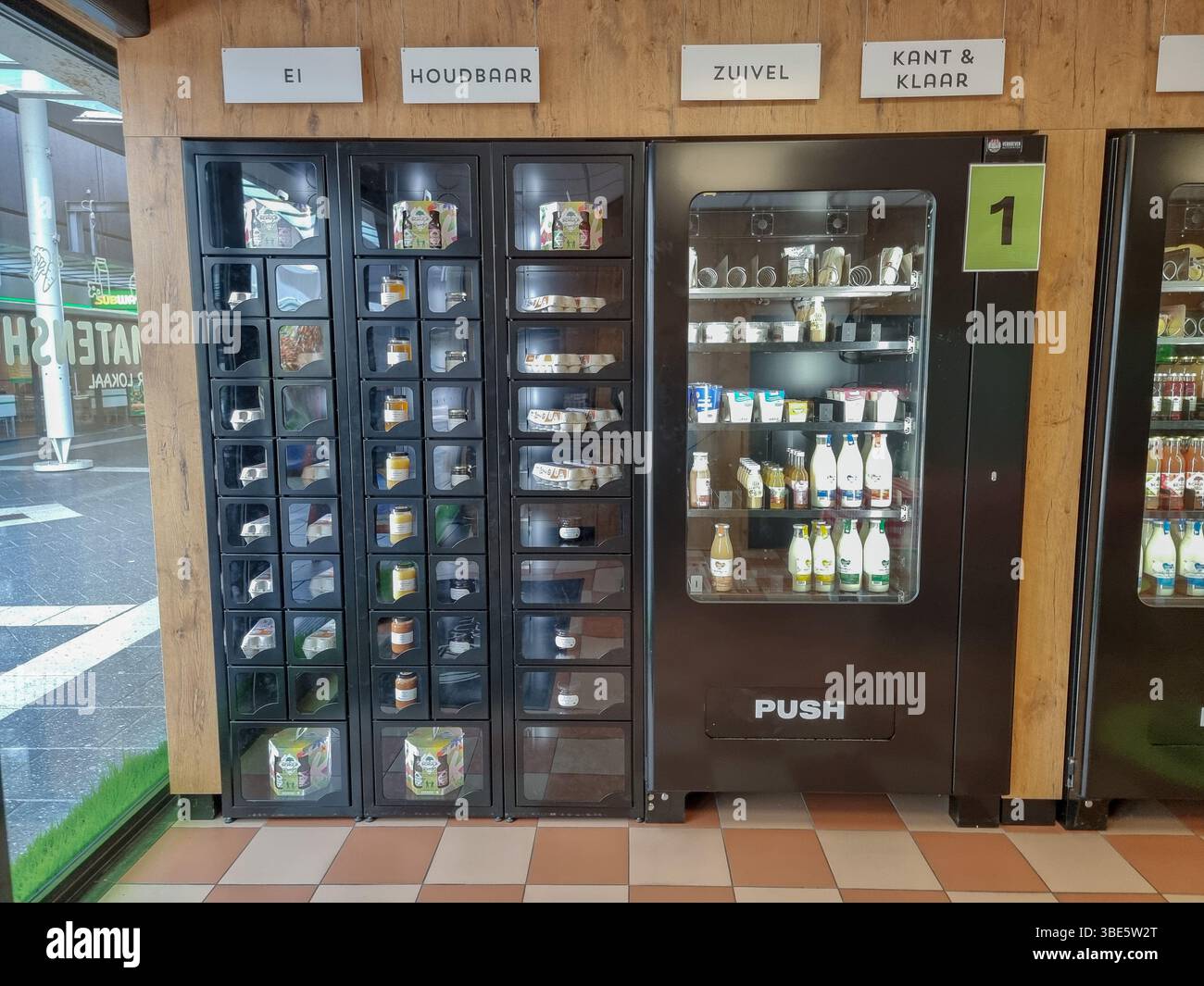 Unmanned shop with only vending machines 'De Aurtomatenshop', selling fresh local food, dairy, meat, eggs, jams, etc. in Eindhoven, The Netherlands - Smartphone Captured Stock Image