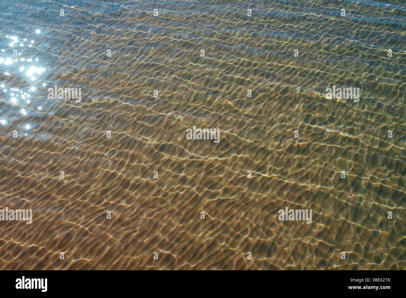 Surface of sea water with sun glare Stock Photo - Alamy